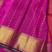 Vaibhogam -Gorgeous Dual tone Orange with Pink with Double Bird Buttas Handwoven Pure Jari Kanjivaram Silk with muthukattam woven body with rich bawanchi borders with green selvedges beautiful pallu with floral buttas woven with contrasting pink blouse