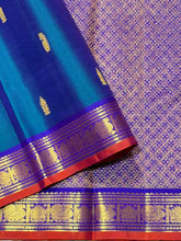 Sahana- Gorgeous Peacock Blue with Violet Combo in a handwoven pure jari Buttas Kanjivaram Silk with small borders orange jamudu with rich pallu and contrast woven blouse