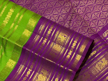 Vaibhogam- Stunning Parrot Green with Purple Handwoven Pure Zari Korvai Kanjivaram Silk with Beautiful Jari Veldhari woven body with rich varisaipet borders gorgeous palli and contrast veldhari stripes woven blouse