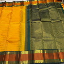 Vaibhogam- Stunning Yellow with Bottle Green Handwoven Pure2g Jari Korvai Kanjivaram Silk with Jari Veldhari woven body with rich silk threads and Jari woven beautiful borders gorgeous pallu and contrast woven blouse