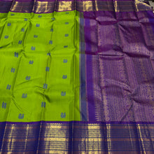 Vaibhogam- Mesmerizing Parrot Green with Violetish Purple Handwoven Pure Jari Korvai Kanjivaram Silk with Pattu buttas woven body with rich borders gorgeous pallu and contrast woven blouse