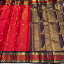Stunning Red with Coffee Brown Vairaoosi with Buttas and Doublepet Meenakari Matte Finish Borders in Jari and Silk threads in a Pure Jari Handwoven Kanjivaram Silk with super gorgeous Kalakshetra kilis woven pallu and a very beautiful contrast blouse.