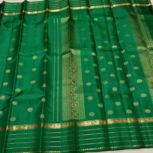 Sahana- Beautiful emerald green with gold handwoven Pure Kanjivaram Silk with beautiful chakram buttas and borders rich pallu and self colored blouse beauty