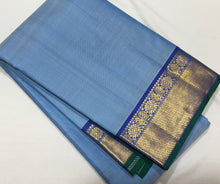 Nayaki- Gorgeous Powder Blue with Peacock Blue Handwoven Pure Jari Kanjivaram Silk with bawanchi borders rich seer pallu and contrast woven blouse