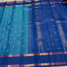 Sahana- Beautiful Blue with dark teal blue combination in a handwoven pure Jari Kanjivaram Silk with buttas woven body with rich borders beautiful pallu and contrast woven blouse