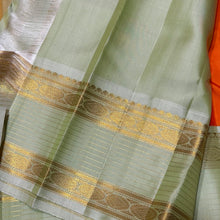 Vaibhogam-Gorgeous Orange with Elaichi Green Handwoven Pure Jari Korvai Kanjivaram Silk with beautiful buttas woven body with rich rudrakshas and jari lines striped borders gorgeous pallu and contrast woven blouse