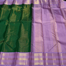Vaibhogam- Gorgeous Deep Emerald Green with Lavendar  Korvai Handwoven Pure Jari Kanjivaram Silk with Vairaoosi Body with beautiful borders rich pallu and contrast Vairaoosi woven lavendar blouse