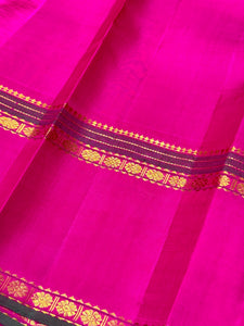 Double tone Orange with Pink with Mallimoggu Buttas and Doublepet Borders in a Handwoven Pure Kanjivaram Silk Saree Beauty