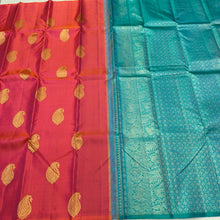 Saranga- Gorgeous Dual tone Orange With Turquoise Green Borderless Handwoven Pure Jari Kanjivaram Silk with Muthukattam woven body with beautiful paisley motifs rich 1000 buttas style woven pallu and contrast woven blouse