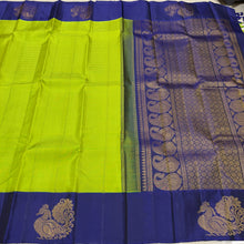 Vaibhogam- Stunning Parrot Green  with Deep Blue  Handwoven Pure Jari Korvai Kanjivaram Silk with beautiful muted checks woven body with gorgeous Hamsas woven on either side of the borders with beautiful rich paisleys wovepallu and contrast Blue blouse