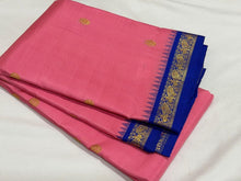 Sarasangi- Gorgeous Peachish Pink with Blue Handwoven Pure Jari Korvai Kanjivaram Silk with Oru kunjam Pillayar moggu with body buttas woven rich meena buttas woven pallu and contrast woven blouse