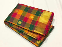 Sahana-Stunning Palum Pazhamum Checks with Beautiful Traditional set of shades with gorgeous jari checked body with mayil chakram buttas woven with bawanchi borders rich arakku pallu and contrast arakku blouse. A beautiful piece for this wedding season!