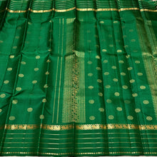 Sahana- Beautiful emerald green with gold handwoven Pure Kanjivaram Silk with beautiful chakram buttas and borders rich pallu and self colored blouse beauty