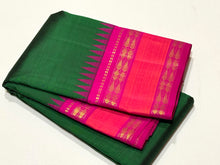 Sarasangi-Stunning Bottle Green with Rani Pink Handwoven Pure Jari Korvai Kanjivaram Silk with Fishpet Borders with temples woven with rich seer pallu and contrast woven blouse.