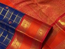 Vaibhogam-Gorgeous Deep Blue Orange Red Handwoven Pure Zari Kanijivaram Silk with rich jari checks and meena buttas woven beautiful body with rich borders pallu very intricately woven and contrast woven blouse
