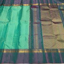 Sahana- Beautiful Turquoise Green with Teal Shot Purple  Muthukattam Handwoven Pure Jari Kanjivaram Silk with beautiful body spaced borders rich pallu and contrast woven blouse