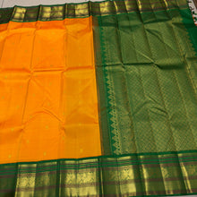 Vaibhogam-Stunning Mango Orange with Emerald Green Handwoven Pure Jari Korvai Kanjivaram Silk with Buttas woven body beautifully woven rich borders pallu and contrast woven green blouse