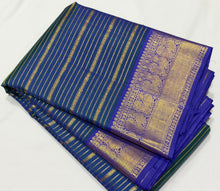 Vaibhogam- Peacock Greenish Blue with Deep Violetish Blue Handwoven Pure 2g Jari Veldhari Striped Kanjivaram Silk with beautiful borders rich pallu and contrast Jari Striped beautiful blouse