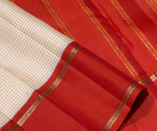 Sarasangi- Stunning Offwhite with Burnt Orange Checked Handwoven Pure Jari Korvai Kanjivaram Silk with beautiful doublepet borders rich pallu and contrast woven blouse