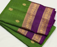 Sahana- Stunning Emerald Green with Dark Purple Buttas Handwoven Pure Kanjivaram Silk with beautiful doublepet borders rich pallu and contrast woven blouse