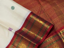 Vaibhogam-Stunning  Offwhite with Ganga Jamuna borders with gorgeous pattu buttas woven body with deep emerald green and burnt orange shade borders beautifully woven rich pallu and contrast woven blouse