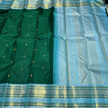 Mindblowing Handwoven Pure Korvai Kanjivaram Silk Saree in Bottle Green with Ice Blue combination with buttas woven body rich varisaipet meenakari borders beautiful pallu and contrast woven blouse