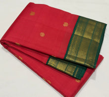 Vaibhogam- Gorgeous Tomato Red with Deep Emerald Green Handwoven Pure 2g Jari Korvai with Buttas Kanjivaram Silk with beautiful borders rich pallu and contrast woven blouse