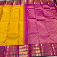 Vaibhogam- Gorgeous Yellow with Rani Pink Handwoven Pure 2g Jari Korvai with Buttas Kanjivaram Silk with varisaipet borders with green selvedges and rich woven pallu and contrast woven blouse