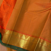 Sahana- Beautiful Biscuit beige with Orange Handwoven Pure Jari Kanjivaram Silk with muthukattam woven body with bawanchi temples and zigzags woven borders with green selvedges rich seer pallu and contrast orange blouse.