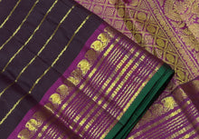 Sahana- Gorgeous Coffee Brown with Dark Magenta Handwoven Pure Jari Kanjivaram Silk with Jari Veldhari woven beautiful body with very beautiful borders with green selvedges rich pallu and contrast woven blouse