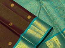 Vaibhogam- Gorgeous Coffee Brown with Turquoise Blue Handwoven Pure Jari Korvai Kanjivaram Silk with Vairaoosi woven body with mayil chakram buttas beautiful rich pallu and contrast oosi woven blouse