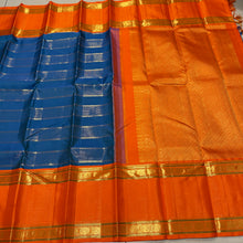 Vaibhogam- Gorgeous Peacock Blue with Orange Handwoven Pure Jari Korvai Kanjivaram Silk with Vairaoosi and Veldhari Striped body with rich doublepet borders with vairaoosi woven middle portions with gorgeous pallu and contrast woven beautiful blouse