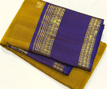 Sahana- Gorgeous Bronze Gold with Violetish Blue Handwoven Pure Jari Kanjivaram Silk with buttas woven body with doublepet borders with gorgeous meenakari woven pallu and contrast woven blouse