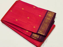 Sahana- Gorgeous Dual tone Tomato Orange with Deep Magenta Small borders with buttas Handwoven Pure Jari Kanjivaram Silk with rich pallu and contrast woven blouse