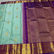 Vaibhogam- Beautiful Pista Green with Purple Handwoven Pure Jari Korvai Kanjivaram Silk with Buttas woven body rich borders pallu and contrast woven blouse