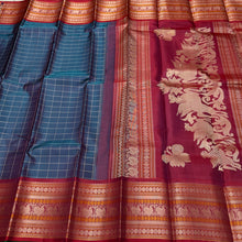 Saraswati- Gorgeous Teal Blue wkth Maroonish Red Handwoven Premium Zariless Kanjivaram Silk with beautiful muthukattam silk checked body with gorgeous varisaipet borders rich sorgavaasal pallu and contrast woven blouse