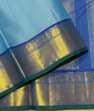 Nayaki- Gorgeous Powder Blue with Peacock Blue Handwoven Pure Jari Kanjivaram Silk with bawanchi borders rich seer pallu and contrast woven blouse