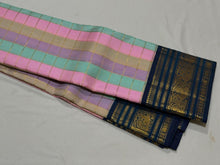 Vaibhogam- Beautiful Palum Pazhamum Jari Checks in pastel palette of colors in Handwoven Pure Zari Korvai Kanjivaram Silk with rich jari checks body with Deep sapphire blue borders intricate and beautifully woven with rich pallu and contrast blouse