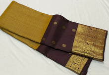 Vaibhogam- Beautiful Bronze Gold with Coffee Brown Handwoven Pure2g Jari Korvai Kanjivaram Silk with middle vairaoosi checks woven beautiful body with lower portions with mayil chakram buttas rich borders and pallu in  coffee brown with contrast blouse