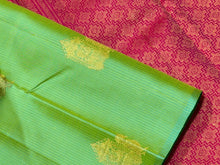 Saranga- Gorgeous Parrot Green with Tomato Pink Handwoven Pure jari borderless Kanjivaram silk with Muthukattam with buttas woven beautiful body with rich pallu and contrast woven blouse