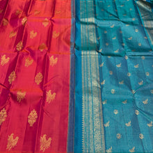 Dual tone Orange Tomato Pink with Peacock Blue Borderless Muthukattam with Double Parrot & Floral Motifs with rich parrots woven pallu and contrast blouse in Handwoven Pure Jari Kanjivaram Silk Saree Beauty