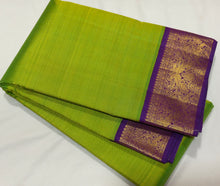 Sarasangi- Gorgeous Parrot Green with Violetish Purple Handwoven Pure 2g Jari Korvai Kanjivaram Silk with beautiful double peacocks woven borders rich pallu and contrast woven blouse