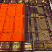 Vaibhogam- Mesmerizing Orange with Deep Coffee Brown Pure2g Jari handwoven Kanjivaram Silk with beautiful pattu buttas woven body with beautiful meenakari work woven rich borders and pallu and contrast woven beautiful blouse