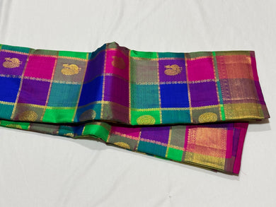 Multichecks with Buttas Rainbow Palum Pazhamum Checks with Mayil Chakram Buttas rich borders gorgeous Pink Pallu and Jari Striped Blouse Beauty