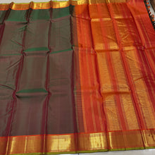 Nayaki- Mesmerizing Manthulir Green with Orange Handwoven Pure Kanjivaram Silk with beautiful bawanchi borders with rich pallu and contrast woven blouse