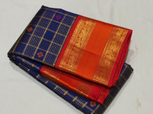 Vaibhogam-Gorgeous Deep Blue Orange Red Handwoven Pure Zari Kanijivaram Silk with rich jari checks and meena buttas woven beautiful body with rich borders pallu very intricately woven and contrast woven blouse