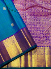 Sahana- Beautiful Peacock Bluish Green with Purple Handwoven Pure Kanjivaram Silk with chakram and thilagam buttas woven body with rich borders beautiful pallu and contrast woven blouse