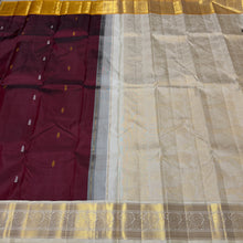 Vaibhogam- Gorgeous Deep Maroon with Mustard and Offwhite Handwoven Pure Jari Korvai Kanjivaram Silk with buttas woven body rich borders dancing women and musical instruments woven pallu and contrast woven blouse