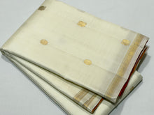 Saranga- Stunning Offwhite with Golden Mustard and Orange Pink Handwoven Pure Jari Small borders kanjivaram silk ,Double Pallu with beautiful mayil chakram buttas woven body rich pallu and contrast zari striped blouse