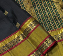 Sahana- Black with Bronze Gold Handwoven Pure Kanjivaram Silk with beautiful buttas woven body with doublepet borders rich zari and thread woven gorgeous pallu and contrast woven blouse